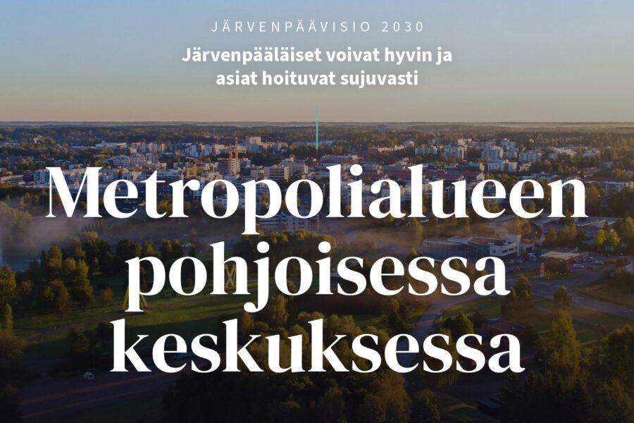 Ilmakuva kaupungista, jonka päällä tekstiä. Keskellä kuvaa teksti "Järvenpäävisio 2030: Järvenpääläiset voivat hyvin ja asiat hoituvat sujuvasti Metropolialueen pohjoisessa keskuksessa".